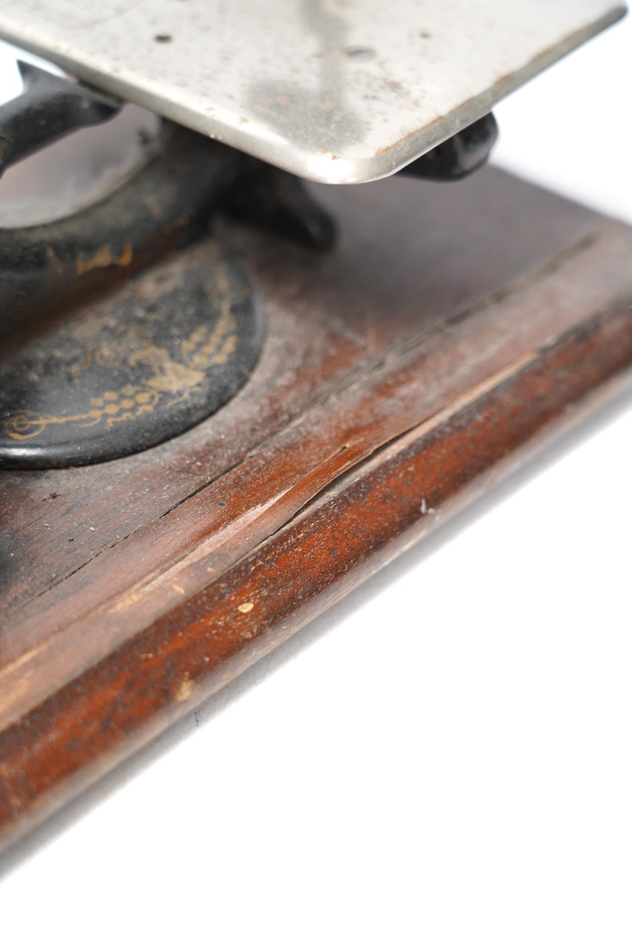 A late 19th century Wilcox and Gibbs sewing machine on a mahogany base. Condition - fair